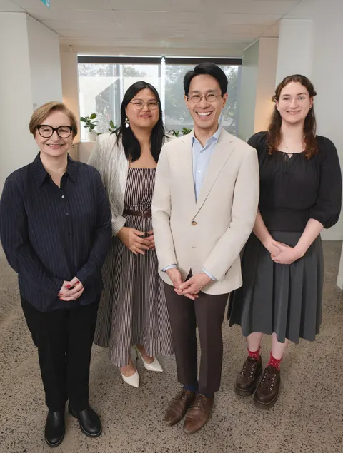 Four members of the Melbourne Balance Clinic team standing together in the clinic