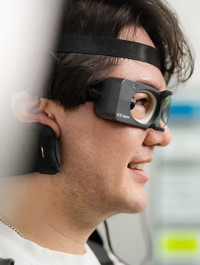 A patient wearing portable video goggles that record eye movements during a vertigo episode at Melbourne Balance Clinic
